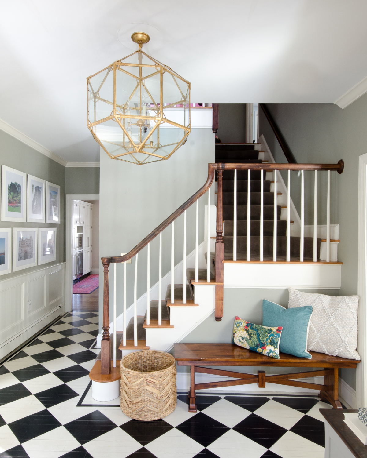 A stunning gold entryway light that is a dread ringer for the Circa Lighting Morris Lantern but at about a third of the price! Checkered floors and simple accents complete the updated classic look of this entry.