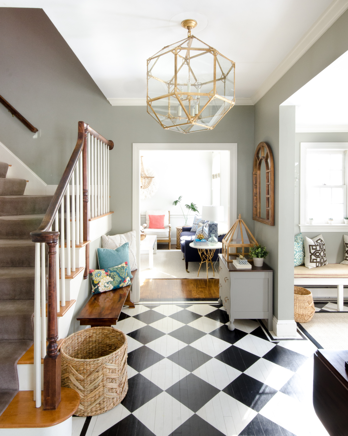 A stunning gold entryway light that is a dread ringer for the Circa Lighting Morris Lantern but at about a third of the price! Checkered floors and simple accents complete the updated classic look of this entry.
