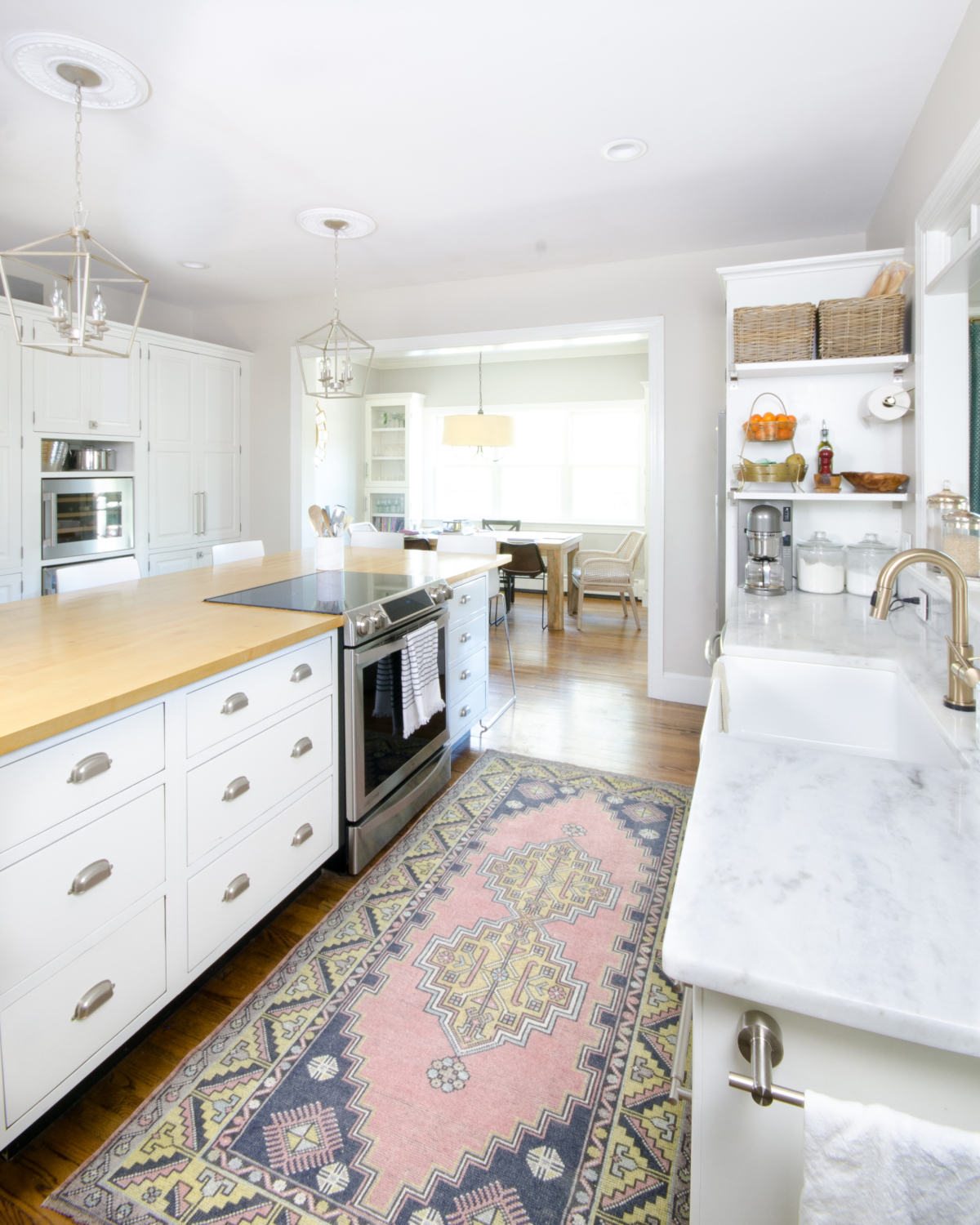 Blush vintage rug in a classic white kitchen, plus sources for similar vintage Turkish rugs in a variety of sizes, all affordably priced!