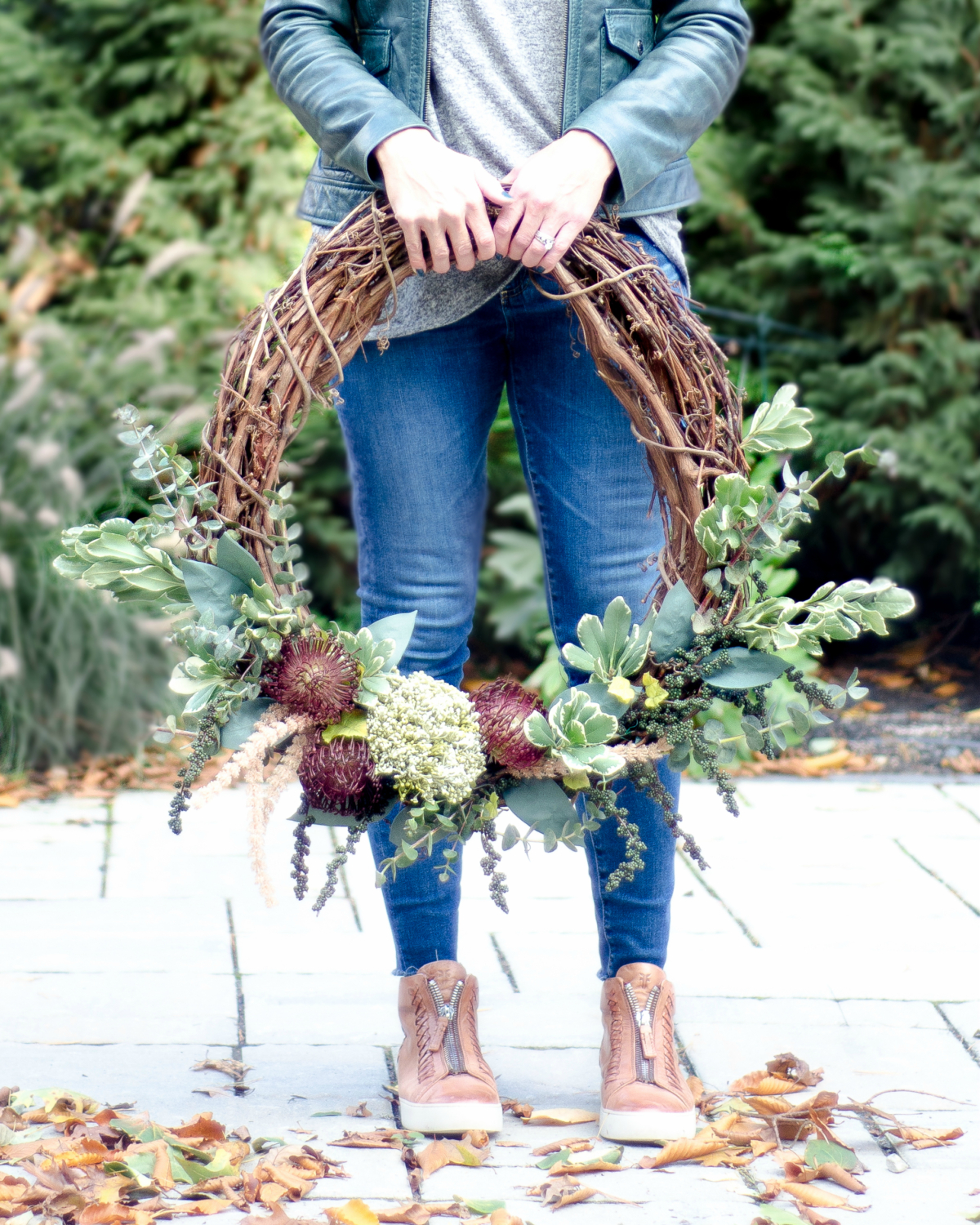 Easy, step-by-step instructions for making a DIY fall wreath with a grapevine base. Budget friendly and done in less than 30 minutes!