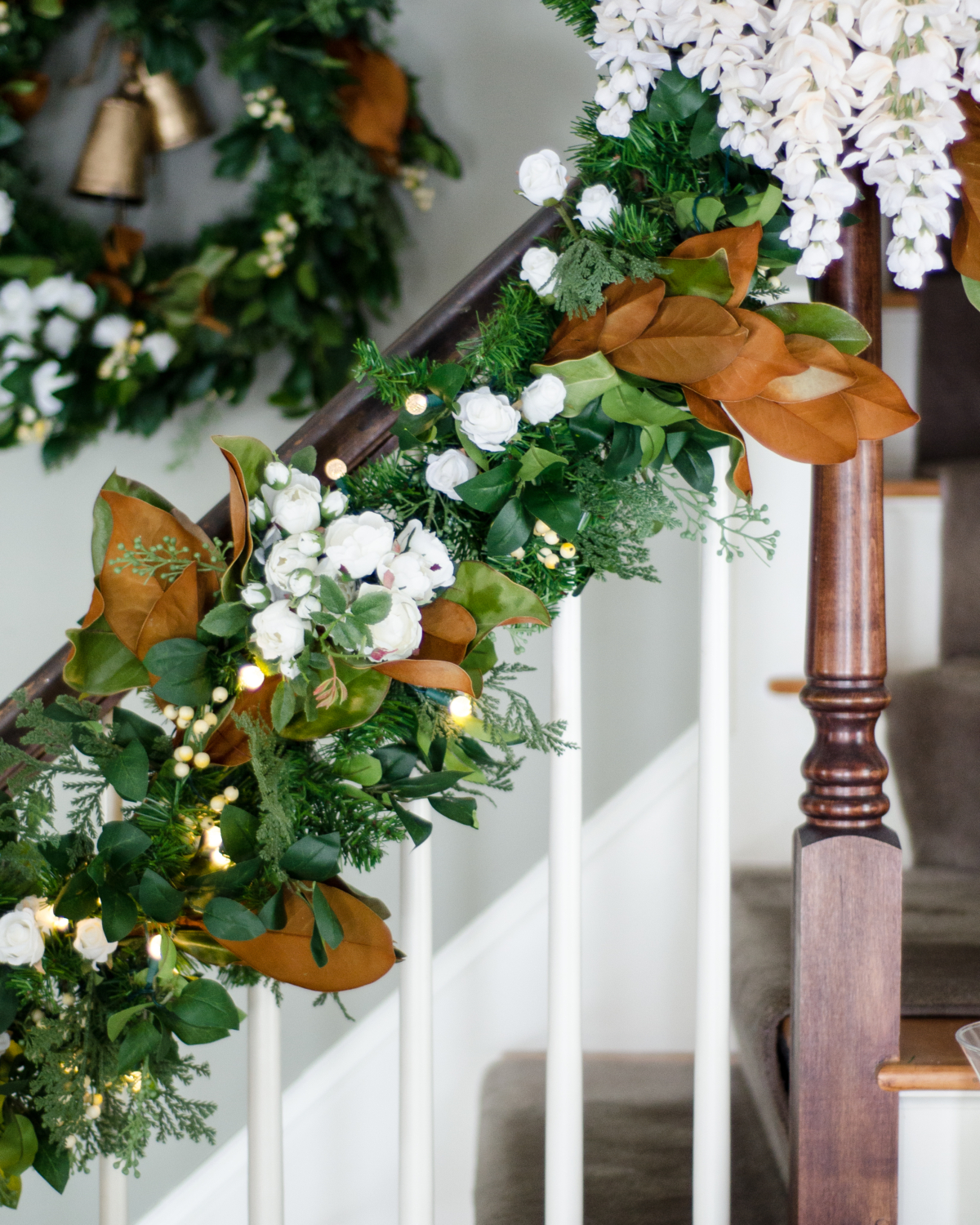 Banister garland with magnolia and white flowers