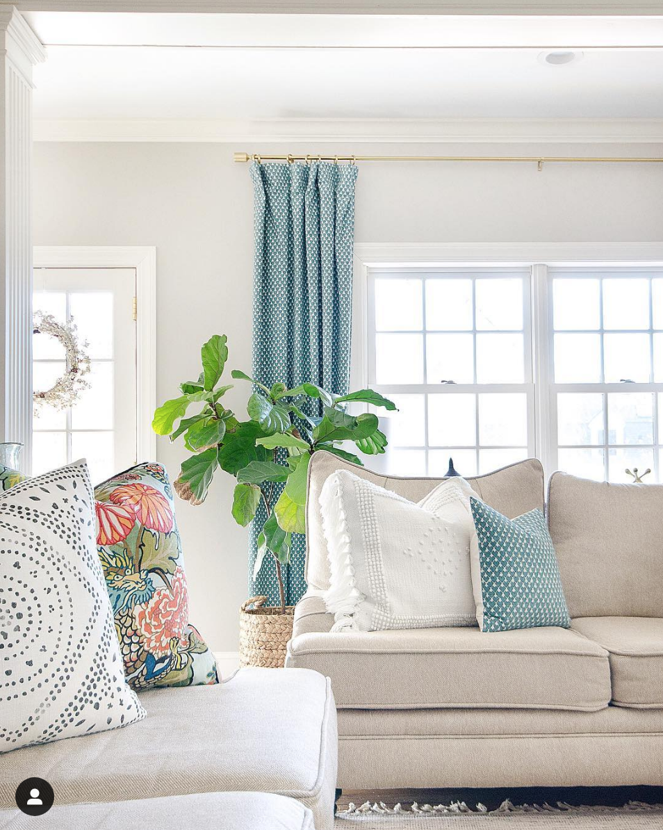 Classic family room that blends neutral and colorful beautifully. Pops of tea; brighten up the beiges and whites.