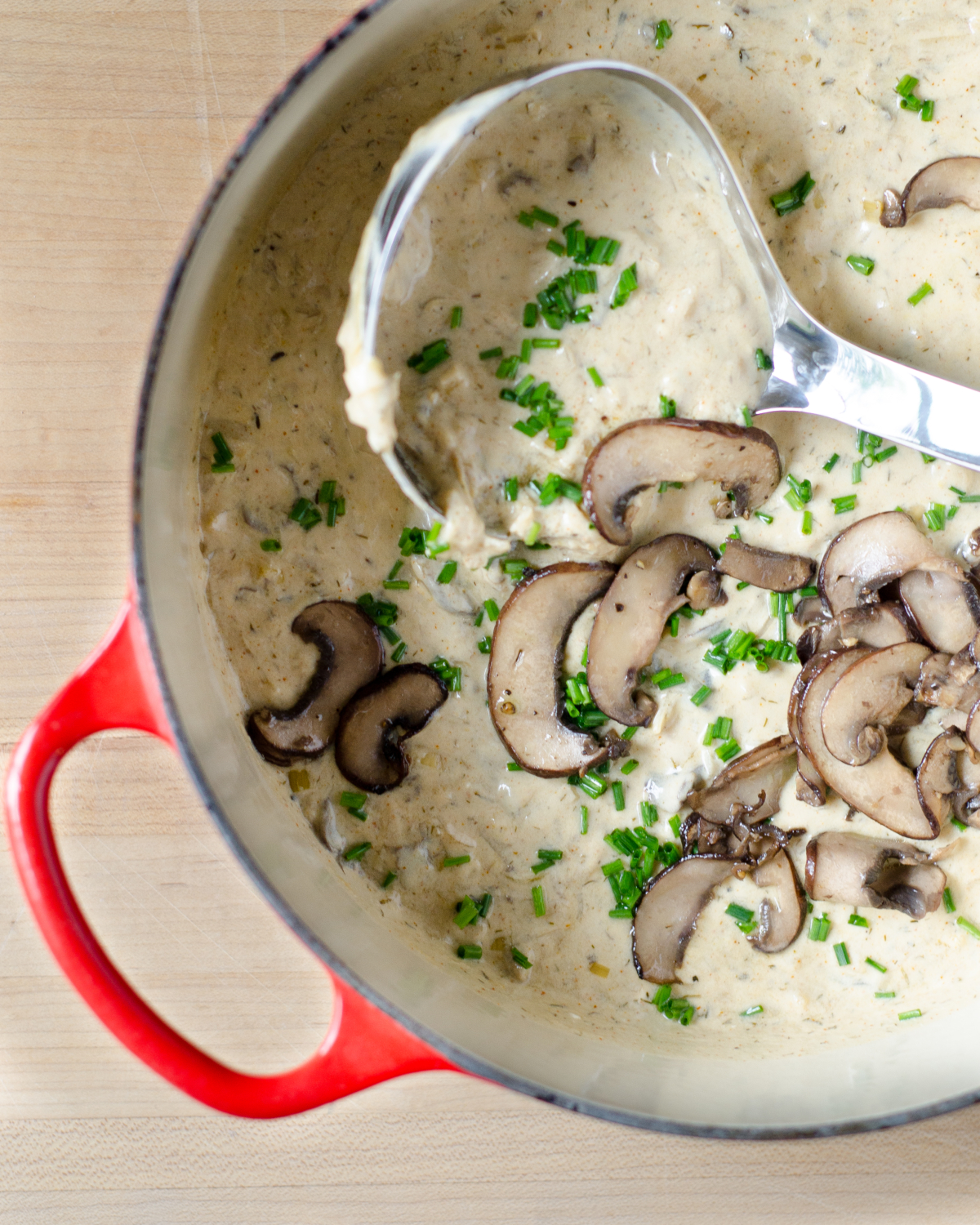 An easy recipe for light creamy mushroom soup (inspired by Hungarian mushroom soup) with an easy trick for luxurious creaminess with much fewer calories. So utterly delicious you'll never know you're eating light!