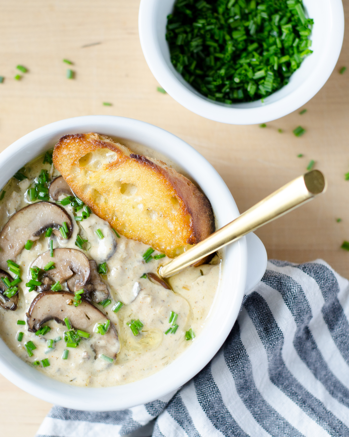 An easy recipe for light creamy mushroom soup (inspired by Hungarian mushroom soup) with an easy trick for luxurious creaminess with much fewer calories. So utterly delicious you'll never know you're eating light!