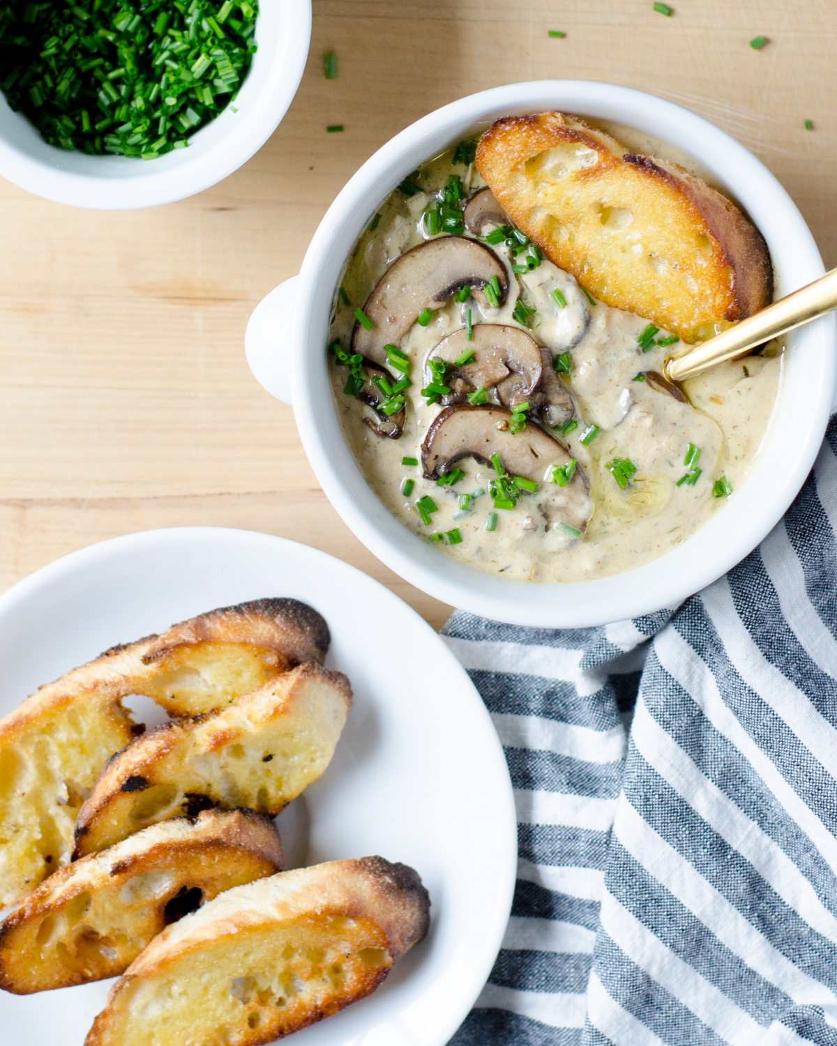 An easy recipe for light creamy mushroom soup (inspired by Hungarian mushroom soup) with an easy trick for luxurious creaminess with much fewer calories. So utterly delicious you'll never know you're eating light!