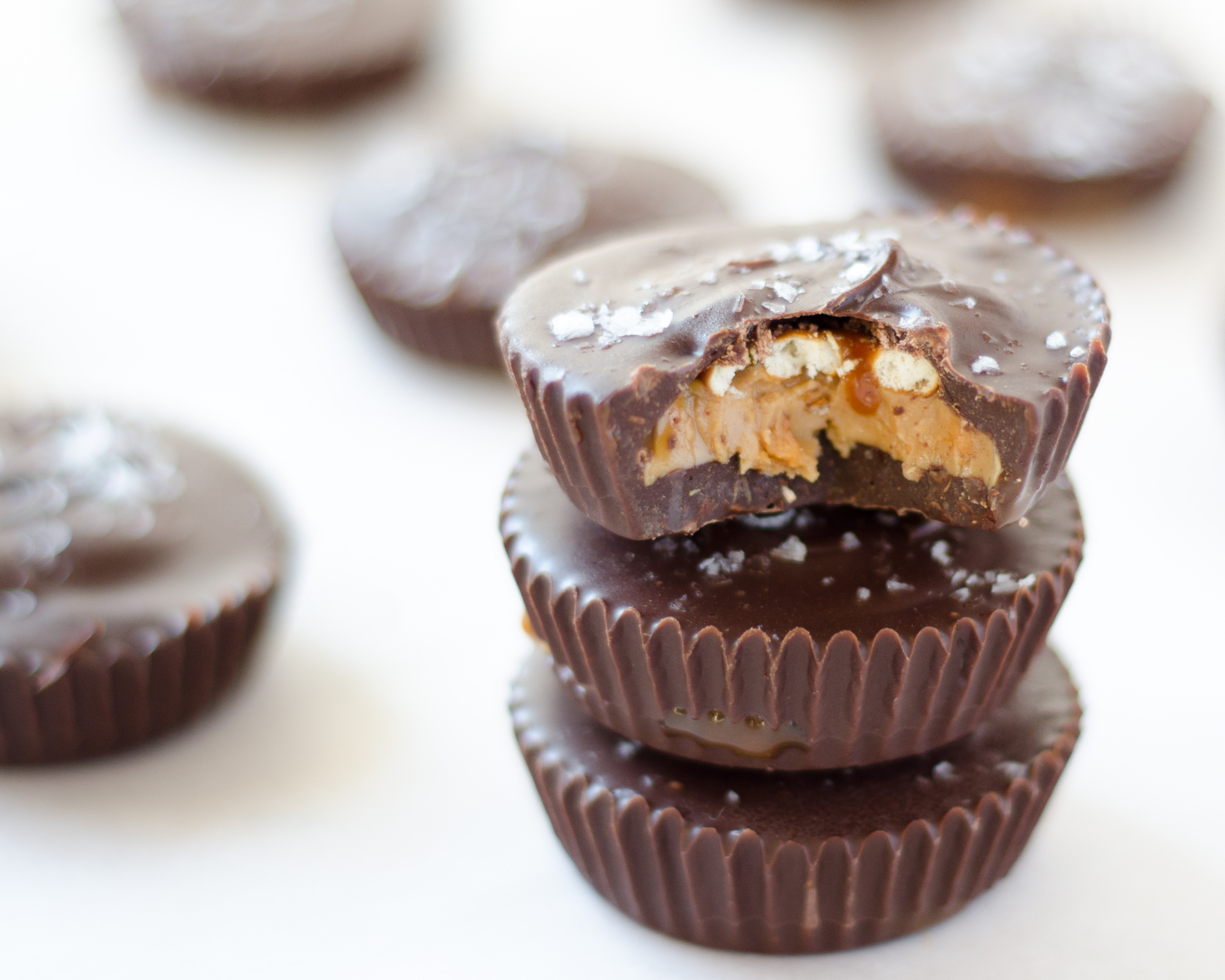 Recipe for the ultimate sweet and salty peanut butter cups filled with peanuts, peanut butter, caramel, and pretzels. A homemade Take 5 candy bar!