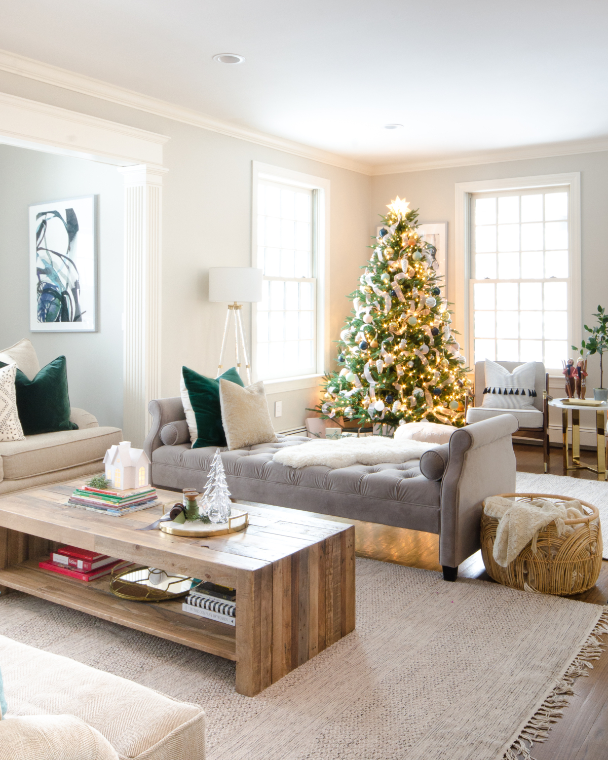 Christmas family room in beige, white, grey velvet, green velvet, and blush pink. Understated and cozy decorating ideas.