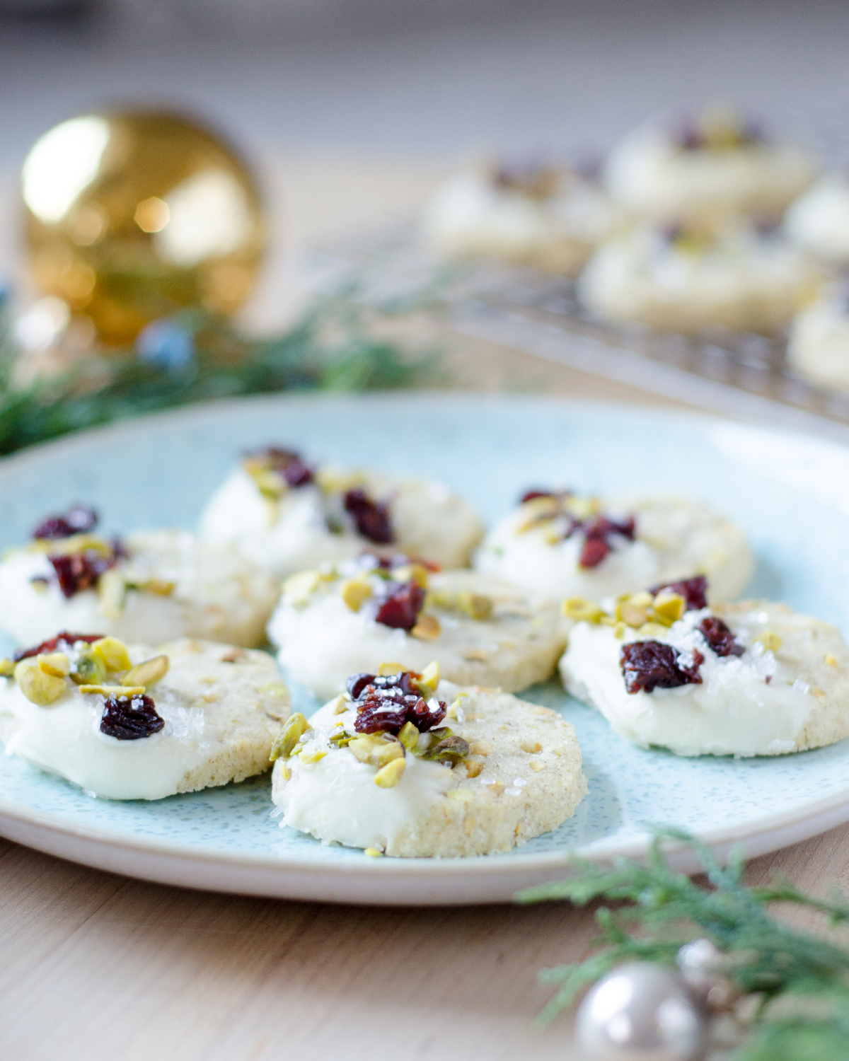 Pistachio cardamom butter cookies that are easy to make and taste nutty, creamy, and delicious. Perfect as a Christmas cookie with subtle red and green!